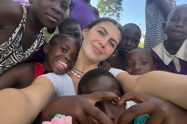 Teenager brings Christmas cheer to Uganda township's children