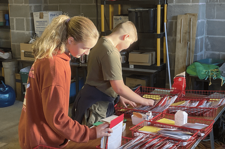 It was a team effort as the 2nd Saltash Scouts worked together to sort the cards at their Latchbrook HQ (Picture: Andrew Jewell)