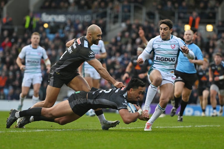 Exeter Chiefs centre Tamati Tua dives over for his side's second try in their Premiership win over Gloucester