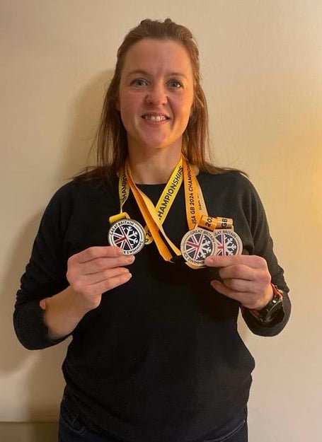 SAM with her medals after the 2024 GB Ice Swimming Championships