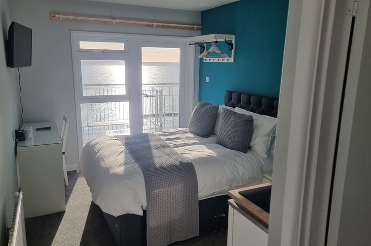 One of seaview apartments in azure blue; all 19 apartments are ensuite with either bath or shower, and a modern, compact kitchenette. (Picture: Fieldhead Hotel)