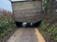 Storm winds lift horse shelter over hedge to block lane at Landulph