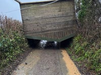Storm winds lift horse shelter over hedge to block lane at Landulph