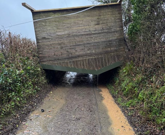Storm winds lift horse shelter over hedge to block lane at Landulph