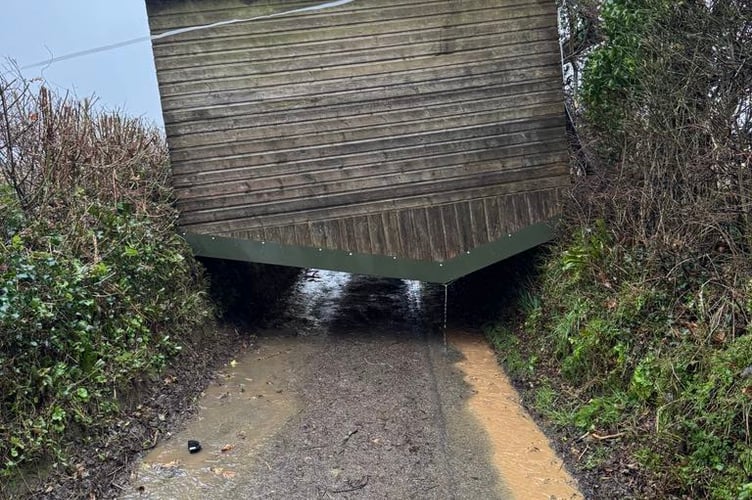A field shelter for horses at Landulph was picked up by storm force winds over the weekend ending up blocking Church Lane near Cargreen. (Picture: Mike Bush)