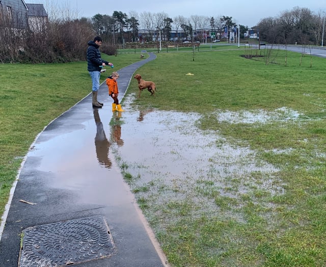 Gardens unusable as Treledan residents fight to hold back the water