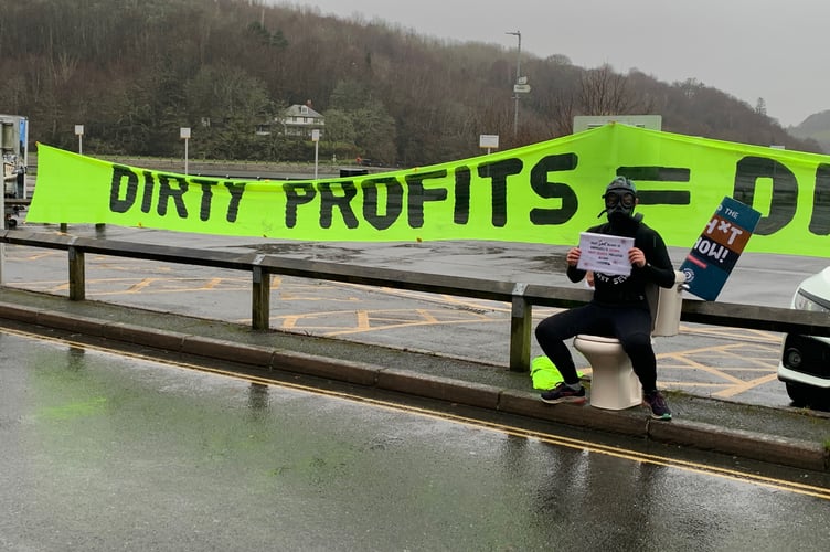 "East Loo(e) beach is Cornwall's second most sewage polluted beach" according to the sign held by protestor Lucy Luck from Surfers Against Sewage protesting at the SWW Looe community roadshow. (Picture: Sarah Martin)