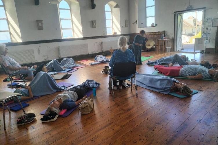 A soundbath session taking place at The Zone. The former Methodist chapel hosts a wide range of events and activities for health and wellbeing