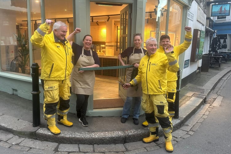 Members of the RNLI in Fowey helped to reopen the Cornish Bakery branch.