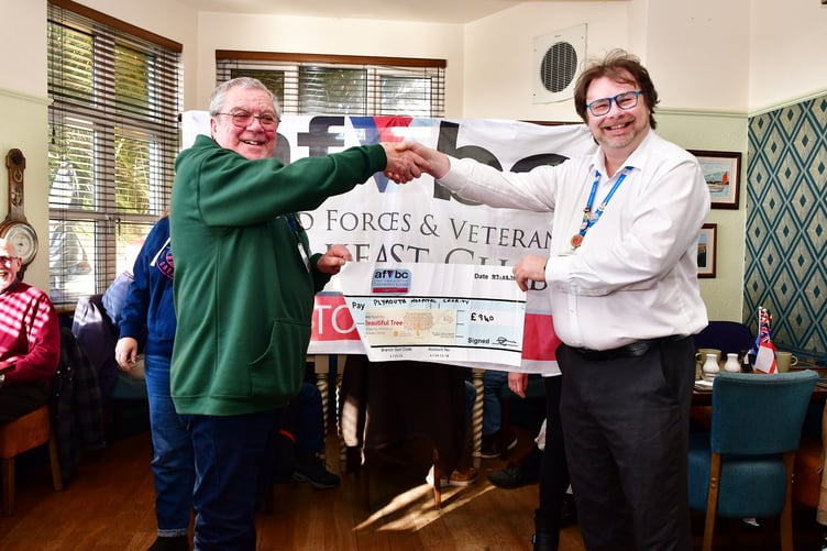 Geoff Prideaux (left) of the Torpoint Armed Forces Veterans Breakfast Club hands over a cheque to Jeff Lee from Plymouth Hospital Charity