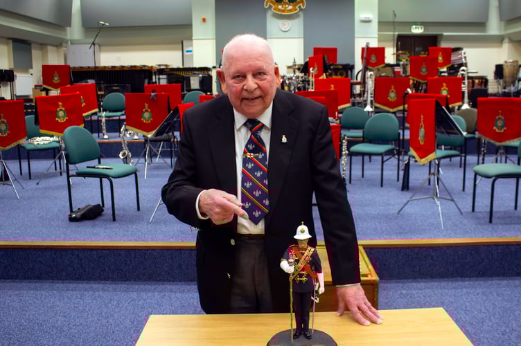 Former Royal Marines Musician George Latham with his treasured statue