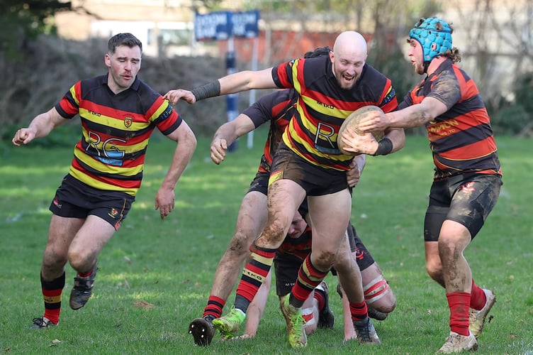 Saltash Fullback Ryan  Cruickshanks backed up by Will Morton. Tackled by Lions Centre Jack Badal.