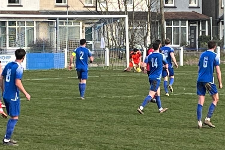 Luke Gwillam saves a long range effort from Truro City substitute Gabriel Turpin.