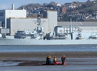 Multi-agency rescue of woman stuck waist deep on mud flats