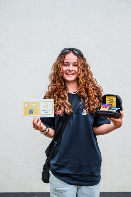Lola Tambling of Saltash holding her medals. (Picture: SKATEBOARD GB)