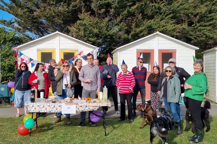 The gathering at the 'white elephant' beach huts at Par.