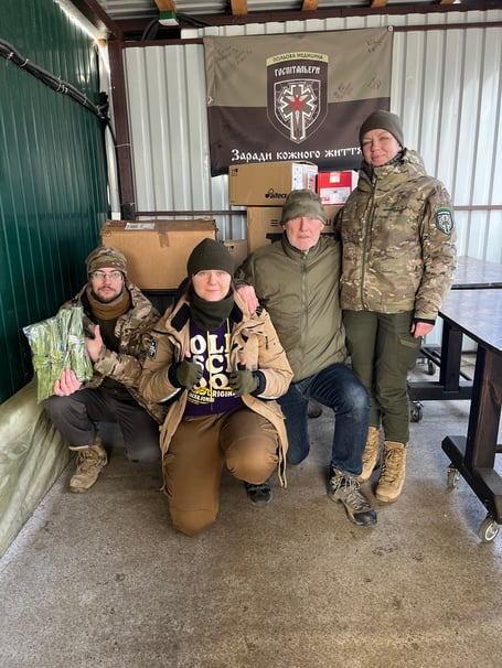 DAVID Pond with a group of volunteer medics. “Kneeling in the centre is the incredible Yuliia. She was seriously wounded herself while evacuating others and now has prosthetic inserts in both legs.”