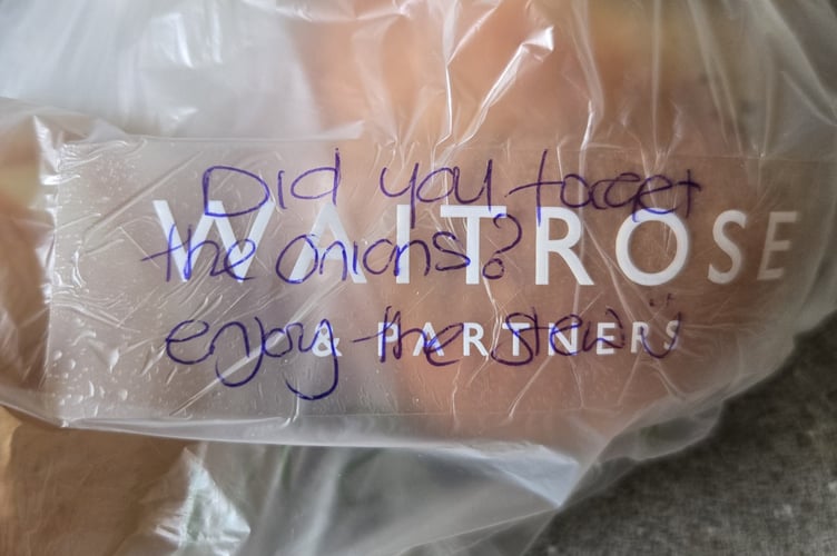 The message on Tom Coneybeare's shopping with two free onions "on" Waitrose after store partner Sue McCann realised they were missing in his order of classic stew ingredients. (Picture: Tom Coneybeare)