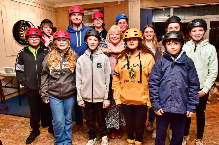 Phillippa Smerdon and the cadets section of the Torpoint Mosquito Sailing Club are all smiles as they show off some of the equipment purchased with funds donated by the Torpoint & Rame Lions Club