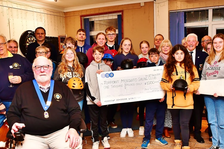 Members of the Torpoint & Rame Lions club are pictured with officials and cadets from the Torpoint Mosquito Sailing Club