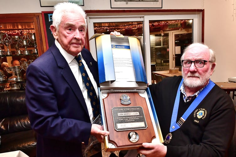 Lion George Dalley (left) is presented with the Melvin Jones Fellowship Award by Torpoint & District Lions president Paul Goodall