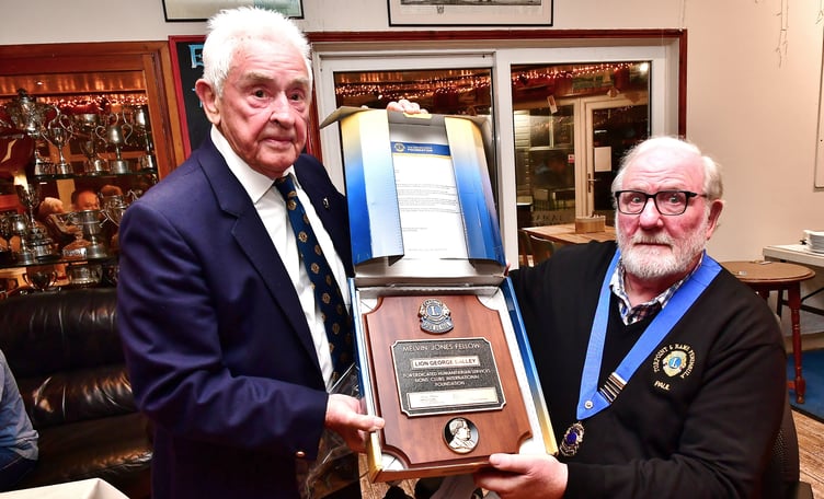 Lion George Dalley (left) is presented with the Melvin Jones Fellowship Award by Torpoint & District Lions president Paul Goodall