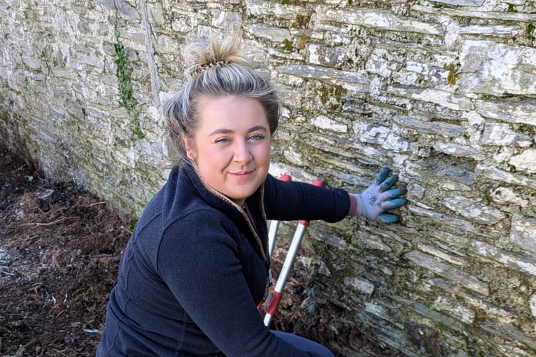 YOUNG farmers helped out by clearing back a space for a new greenhouse