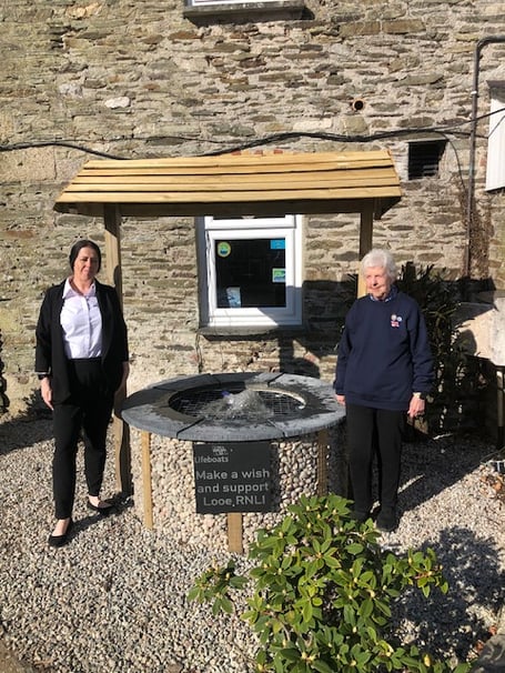 The wishing well is official unveiled at John Fowler Killigarth Manor by RNLI shop volunteer Sue and Zoe on behalf of the Killigarth Manor team. (Picture: RNLI Looe)