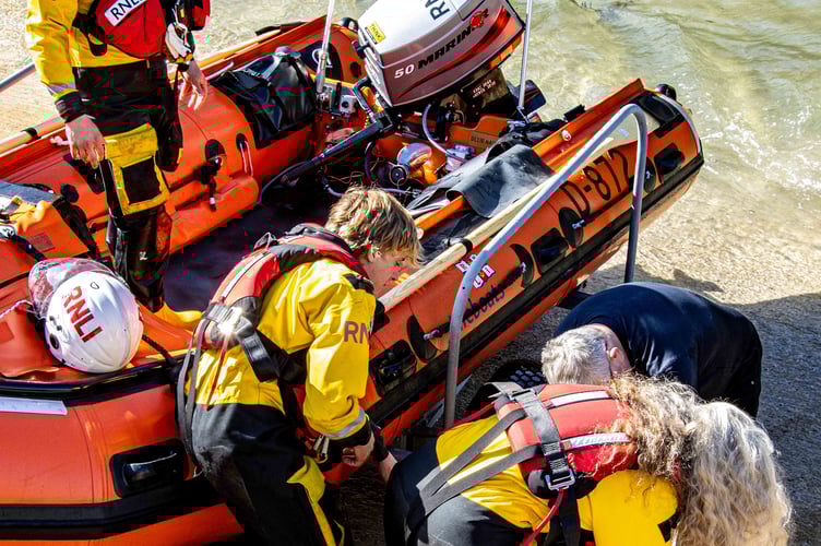 Roxy the Bulldog is rescued by crew members from Looe RNLI after falling into the Looe River