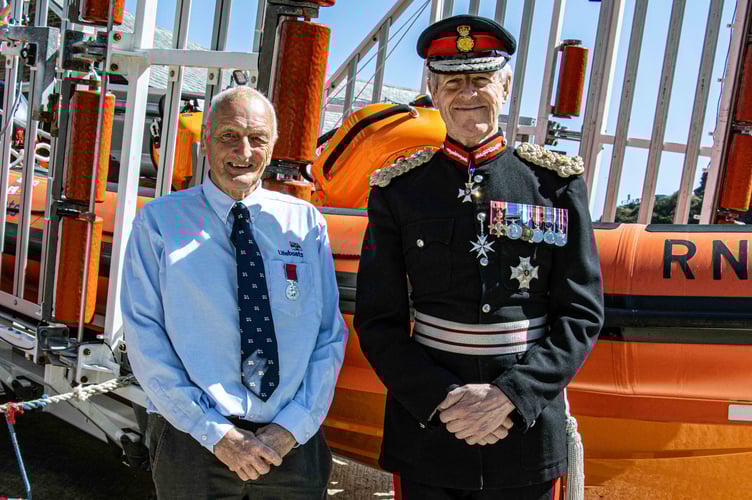 Former Looe RNLI Operations Manager, David Haines, is presented with his British Empire Medal by the Lord Lieutenant of Cornwall,  Colonel Sir Edward Bolitho