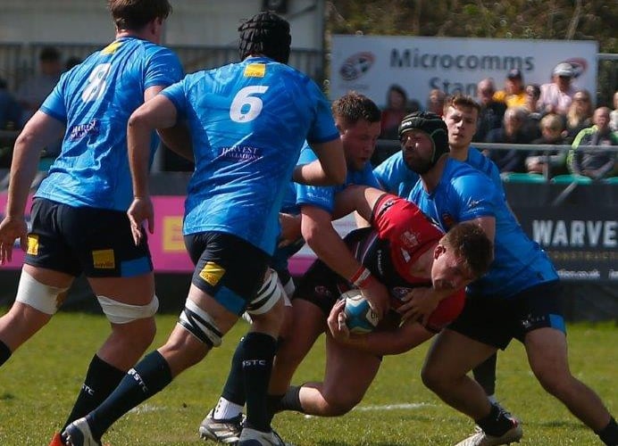 Cornish Pirates hooker Harry Hocking powers over for one of his two tries against visiting Cambridge