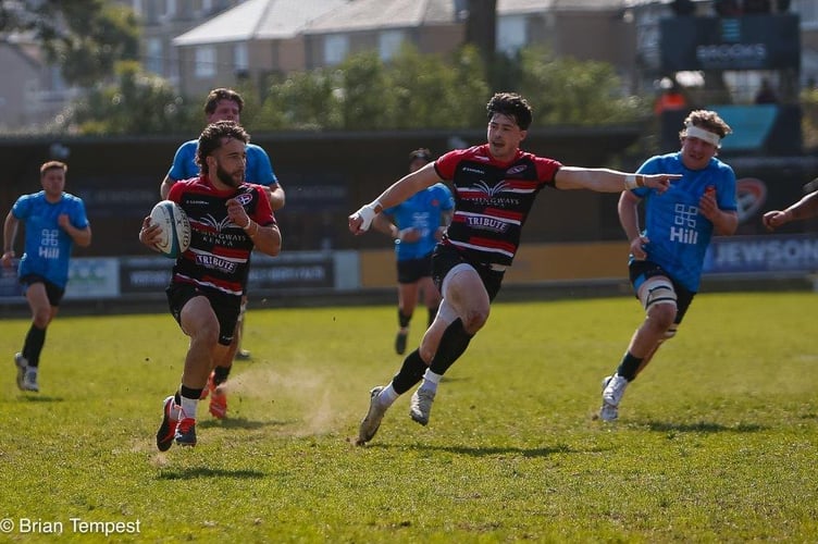 Cornish Pirates scrum-half Dan Hiscocks races over for a try with team-mate Robin Wedlake pointing the way to the line against Cambridge