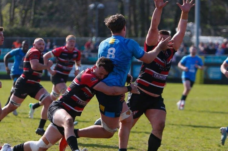 Cornish Pirates fly-half Bruce Houston puts in a big hit on Cambridge No.8 Reuben Logan