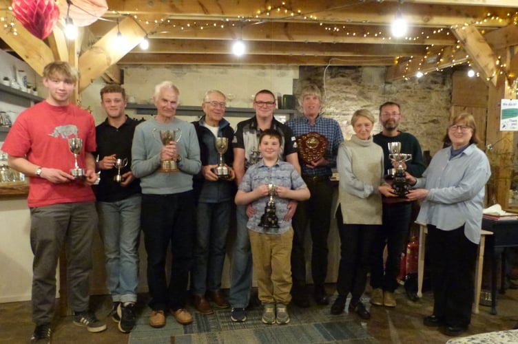 Left to right; Finlay Morgan, Benjamin Morgan, Ian Turpitt, Peter Grzelinski, Commodore Mark Lentell with William Lentell in front, Robin Davis, Lynda Grzelinski and Trish Guthrie, with Guy Pearson behind them.