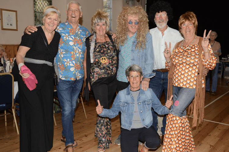 All smiles for these locals at the 60s and 70s-themed evening