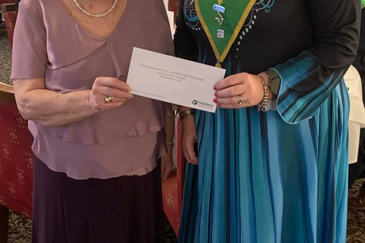 Joan Thomas of the Foresters in Cornwall makes a presentation to the High Chief Ranger Jo Andrew
