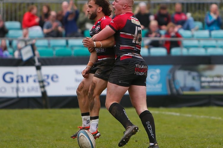 Cornish Pirates duo Dan Hiscocks and Harry Yates celebrate a try during their win against Caldy