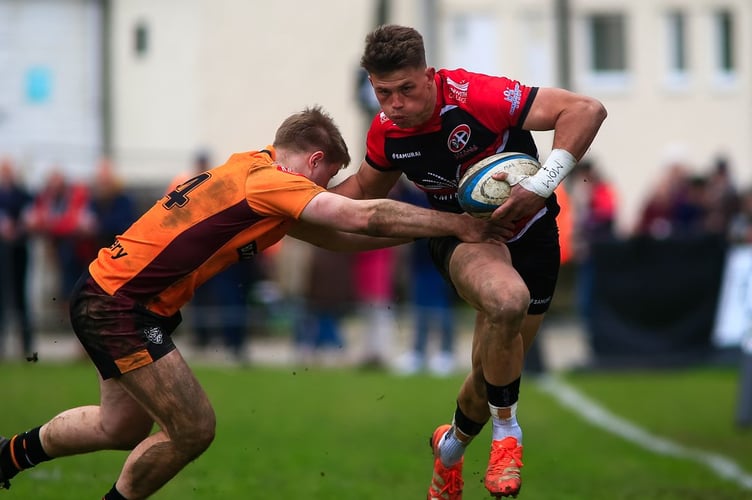 Cornish Pirates winger Matt McNab looks to find a way around a Caldy rival