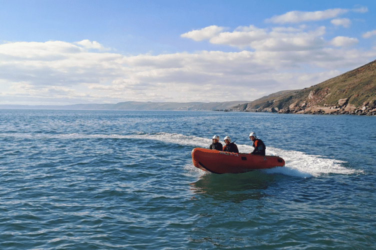 RNLI lifeguards carry out training duties at Tregonhawke Beach