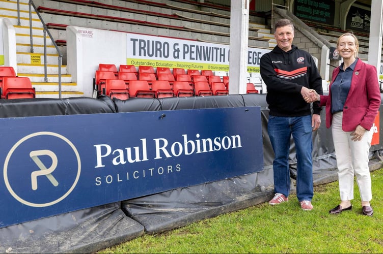 John Branch of Paul Robinson Solicitors and Sally Pettipher, Chief Executive of the Cornish Pirates, shake hands on the new two-year sponsorship deal