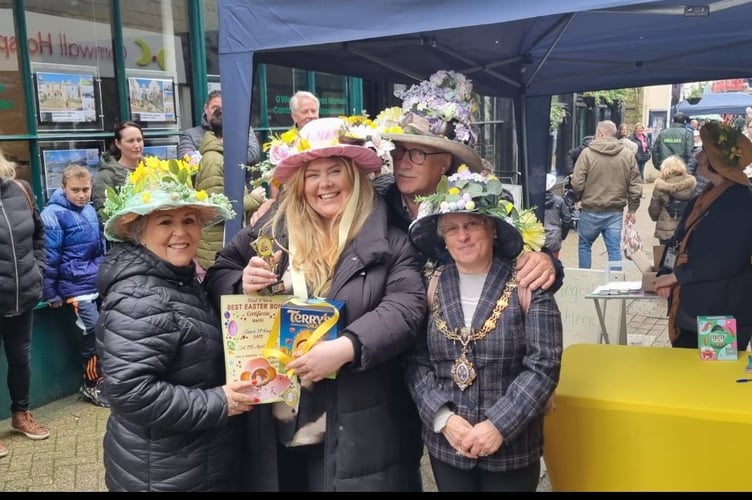 Judges of the Easter Bonnet competition with one of the winners at the Liskeard Easter Family Fun Day