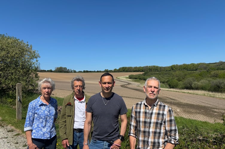 Pictured in front of just one of the fields mooted for a 105-acre solar farm at Lanreath are, from left: Yolande and Bruce Milburn, Richard Kramer and Gary Williams