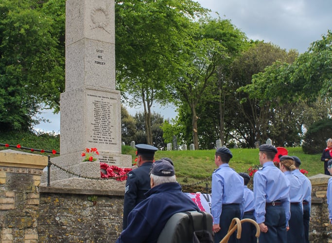 A moment of remembrance is held at the War Memorial in Landrake