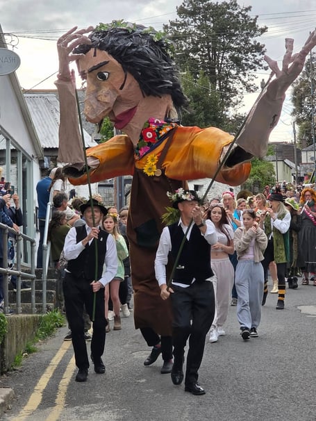 A procession led by puppet giant Tavy leads a procession with a record number of musicians through the village. (Picture: Mandy Haxby)