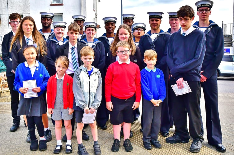 Local school children and recruits from Corporate Squadron were among those who gathered to pay their respects in Torpoint. Picture: Andy Campfield