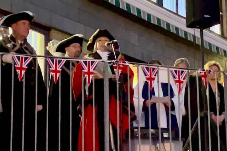 Saltash Town Mayor, Cllr Julia Peggs, reads a message to thosw who had gathered at the Waterside for the VE Day 80 celebrations. Picture: Cornish Times