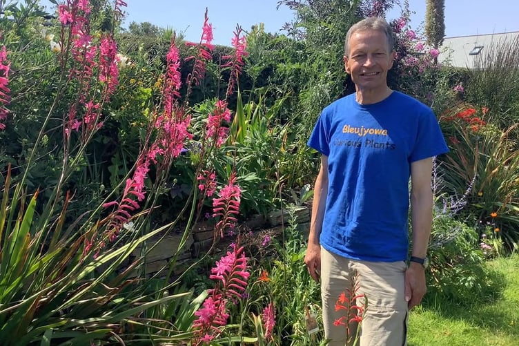 Martin Pallett with some colourful plants.