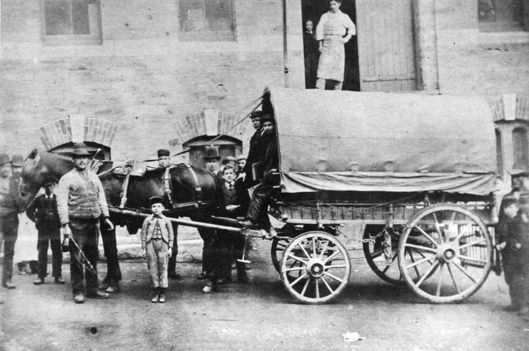 Loading a Henwood's wagon at the Well Lane warehouse in the 1880s