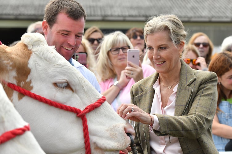 Sophie the Duchess of Edinburgh presenting the award for Best Team of Five Beef Animals of a Breed to the Tregnether herd of British Simmentals exhibited by David Reeves and Stephanie Hooper from St Columb Major