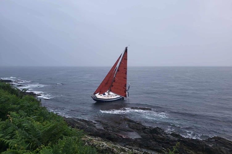 The yacht on rocks near Chapel Point on the Cornish coast. Picture: Mevagissey Coastguard